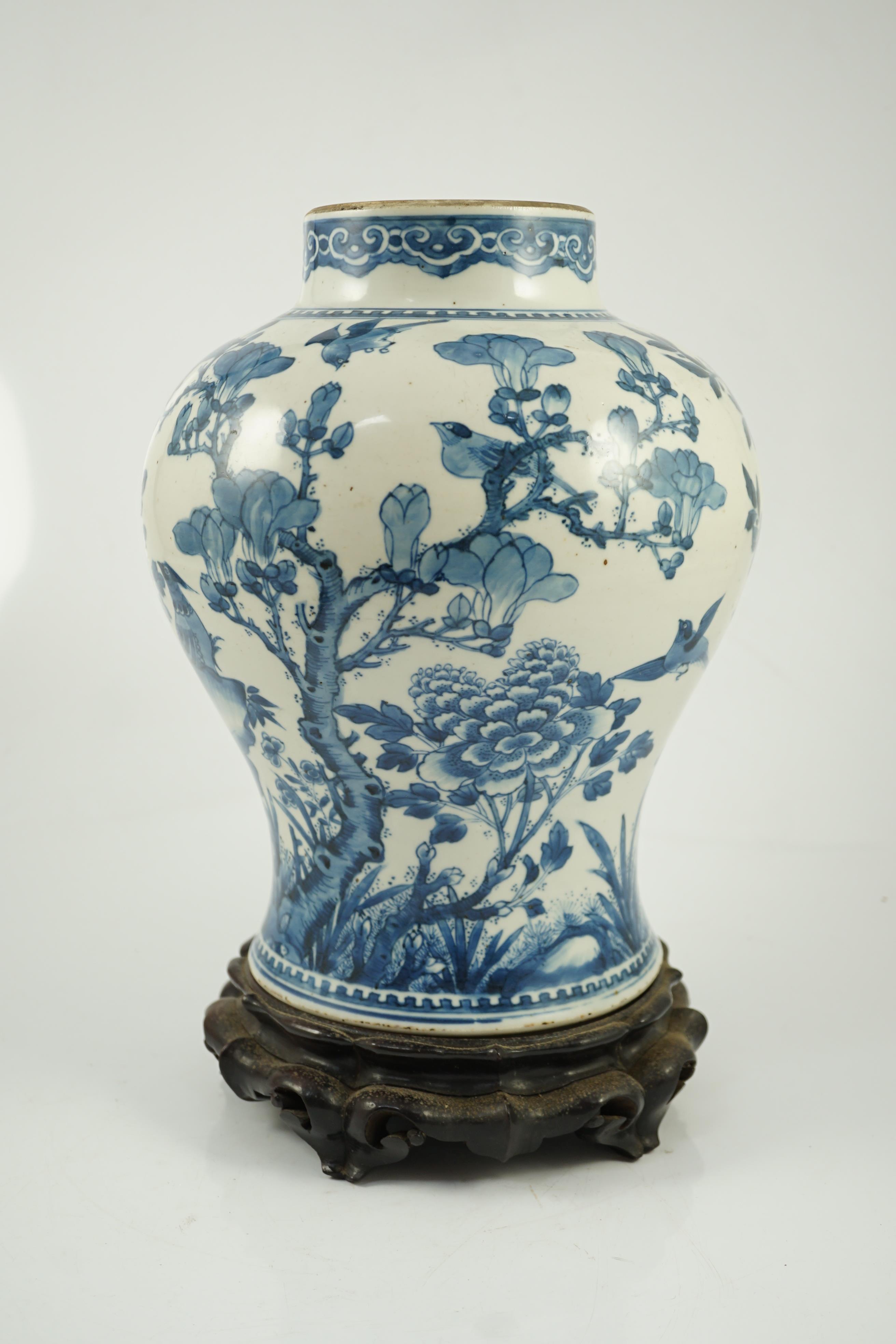 A Chinese blue and white ‘birds and blossom’ baluster vase, Kangxi period